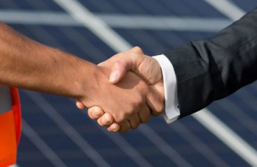 handshake to show drainage contract has been renewed